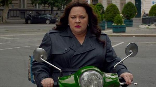 Melissa McCarthy gets on her bike in Spy.